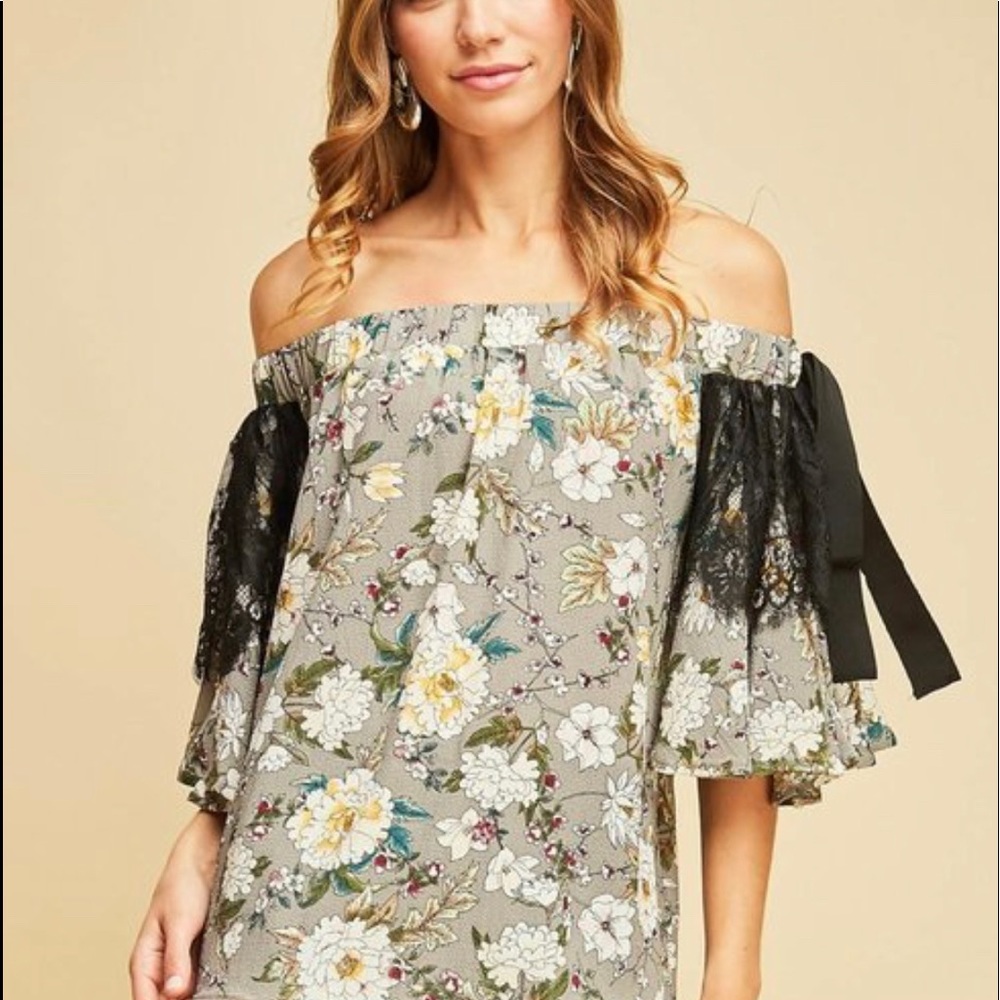 Floral off shoulder top with black lace.